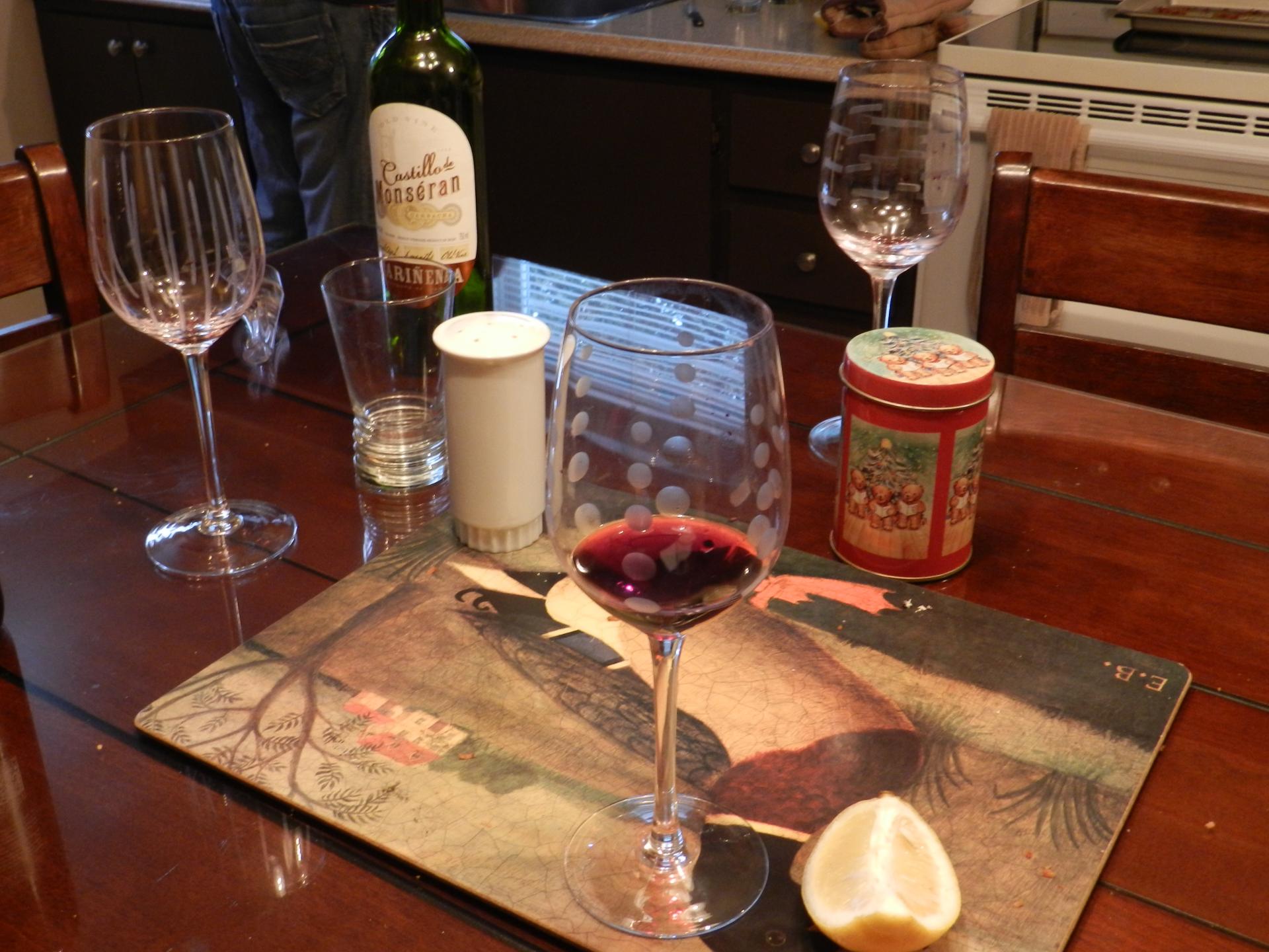 Glasses and bottles on wooden table