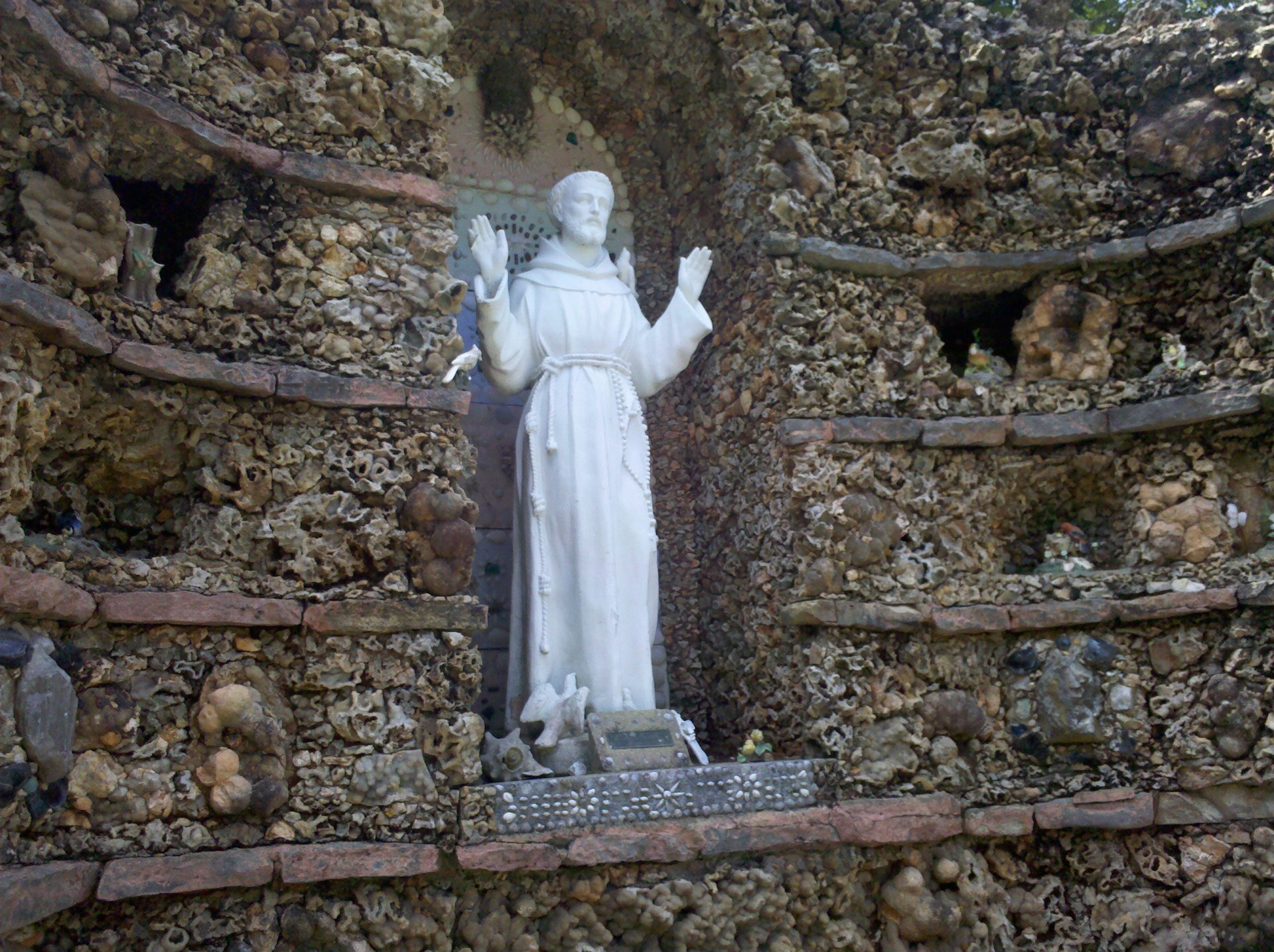 Saint Francis Statue In Grotto