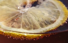 A Slice Of Fresh Lemon In Beverage