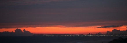 City Lights Across A Bay At Sunset