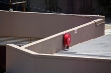 Fire Hose On Red Reel On Rooftop