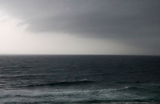Heavy Grey Cloud Over The Ocean