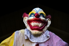 Grinning Clown Face On Dark