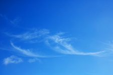 Light Wispy White Cloud In Blue Sky
