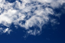 Loose Thinning Cloud In A Blue Sky