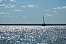 Oil Derrick On Lake