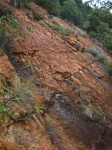 Steep Rock Slope On Side Of A Hill