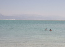 Two People Floating In The Dead Sea
