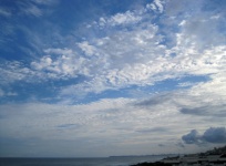 White Clouds Spread Wide Over Coast