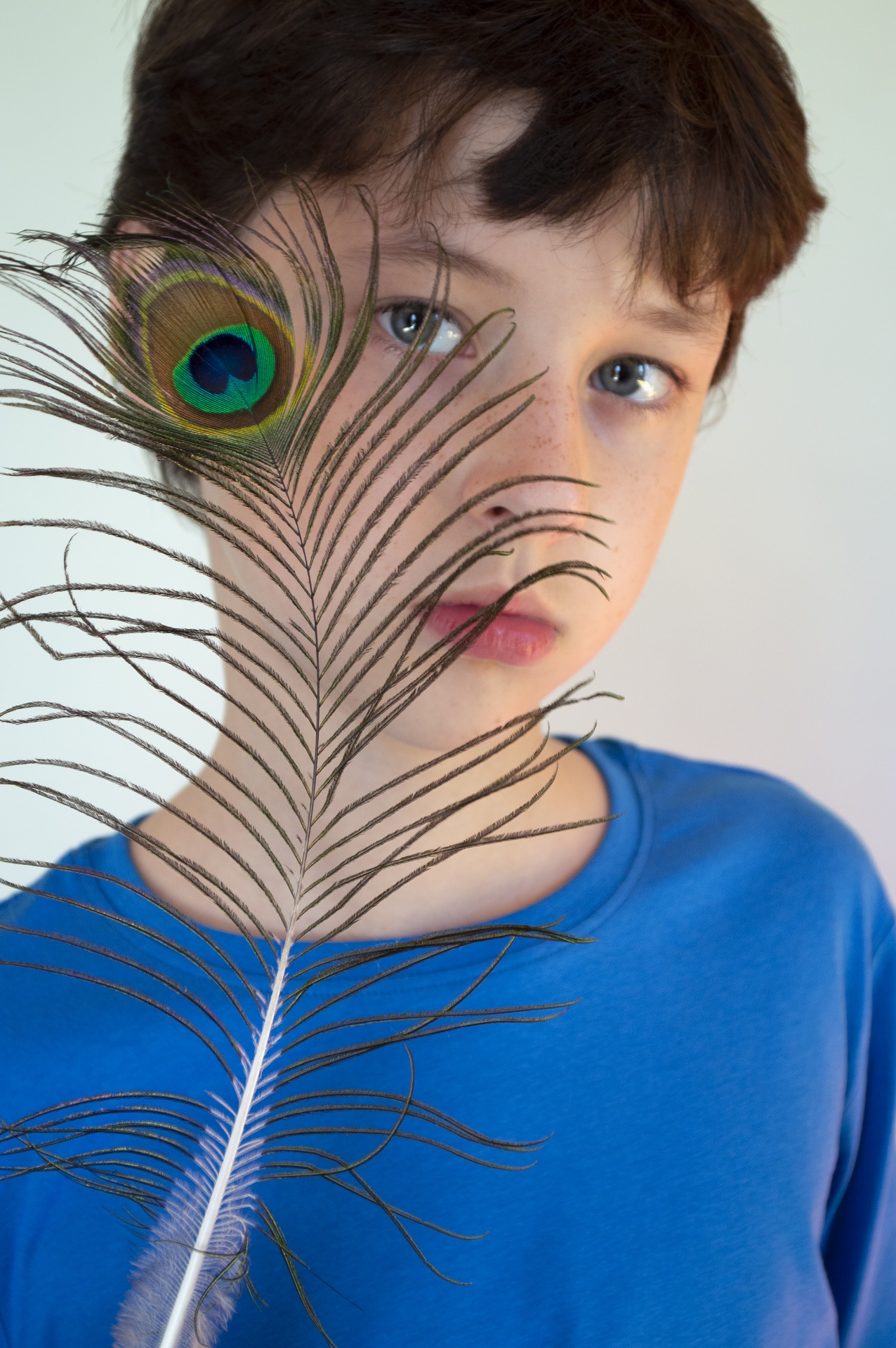 Portrait Of A Boy With A Peacock