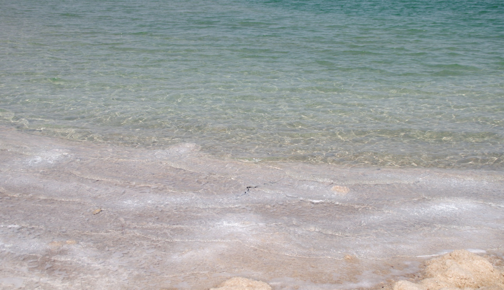 White waves on Dead Sea beach