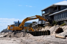 Backhoe Working On The Beach