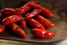 Bright Red Chilis In A Wooden Bowl