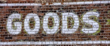 Brick Wall With GOODS Painted Words
