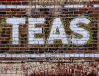Brick Wall With TEAS Painted Words
