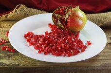Pomegranate Seeds And Open Fruit