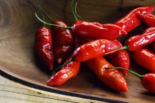 Red Chilies In A Wooden Bowl