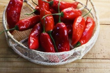 Red Chilis In A Gause Basket