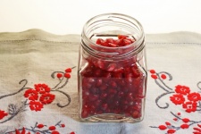 Red Pomegranate Seeds In A Jar