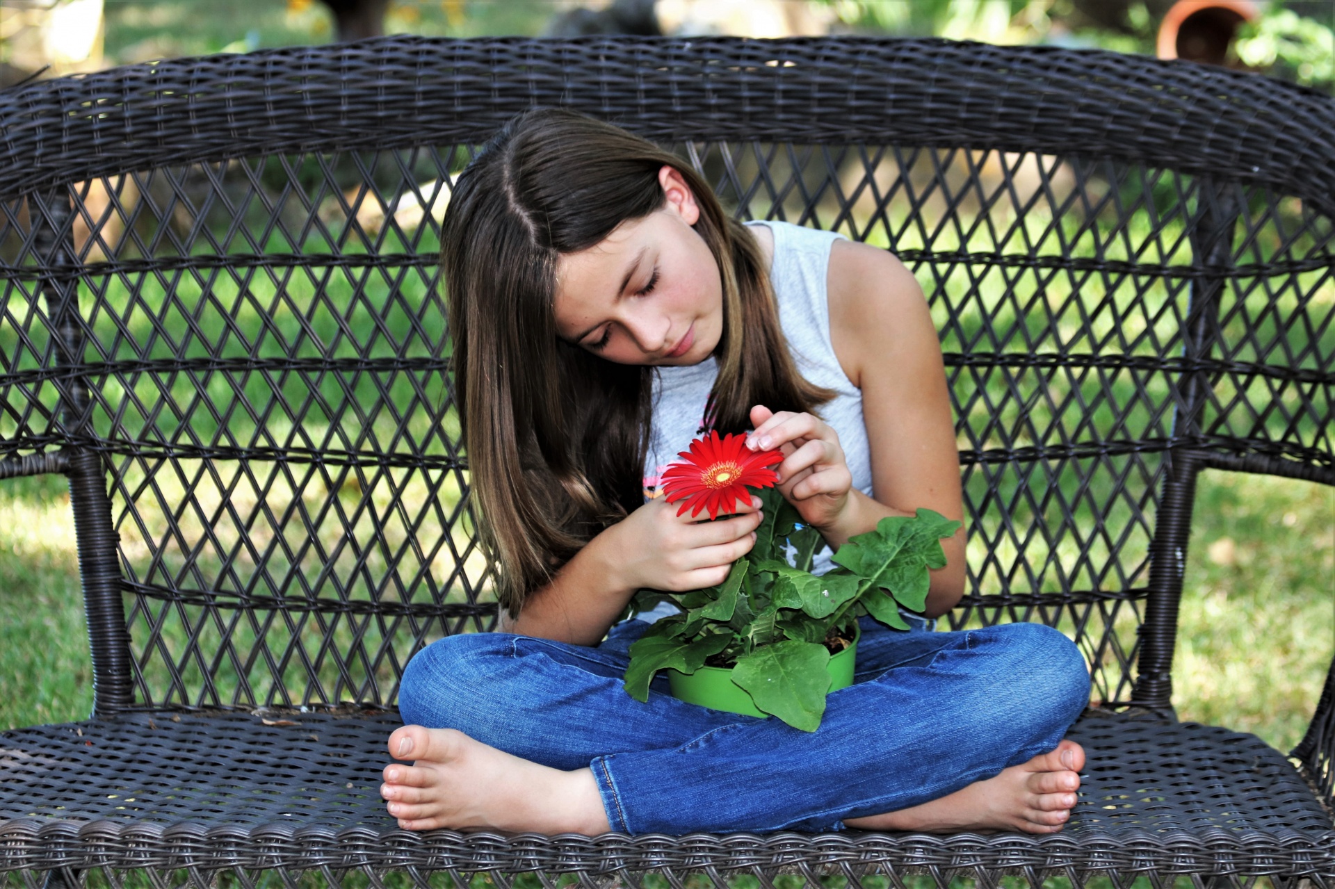 Girl Holding Red Flower