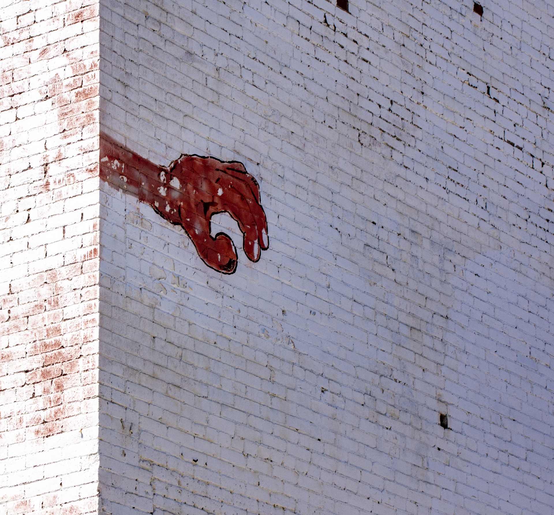 Graffiti Hand On Brick Wall