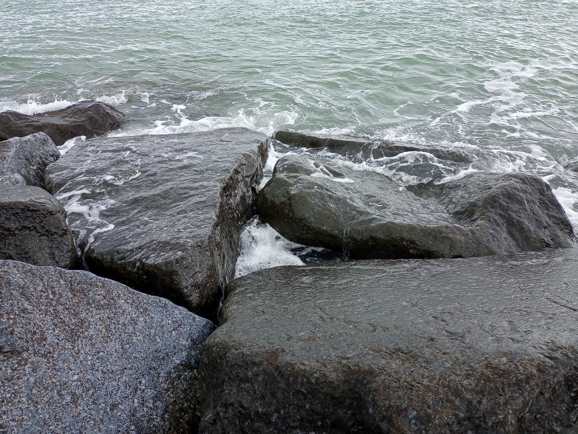 Rocks waves on beach side