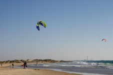 Beach With Wind Kite Surfers