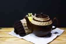 Brown Ceramic Teapot And Cozy