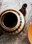 Brown Ceramic Teapot On Silk Cloth