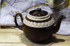 Brown Ceramic Teapot On Wood