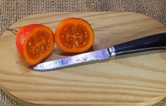 Cut Ripe Tree Tomato Fruit On Wood