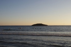 Swimmers With Small Island