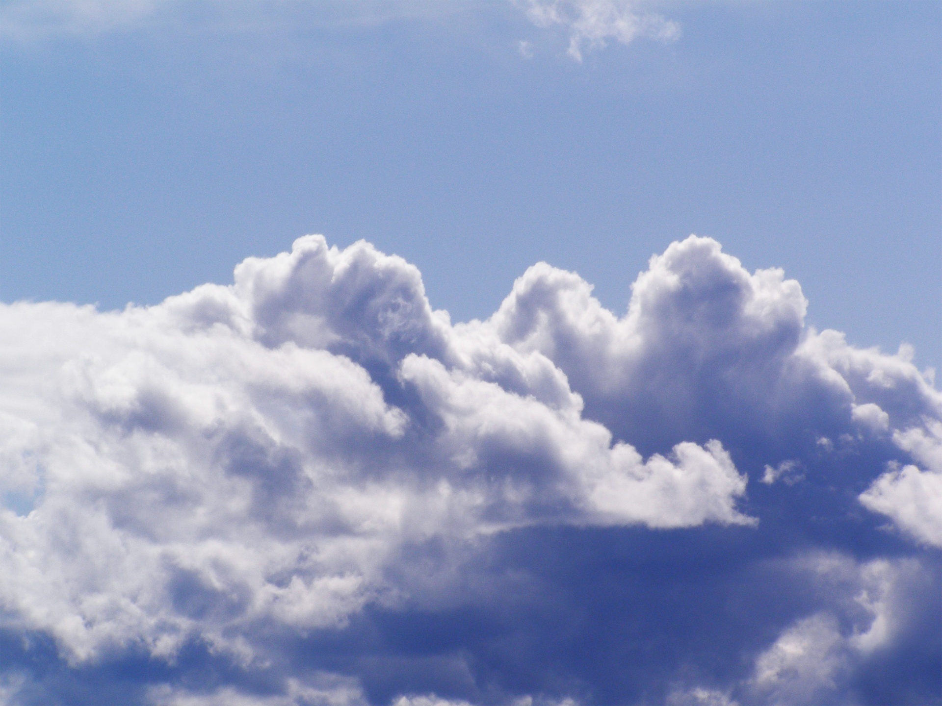 Thick cumulus clouds and blue sky background