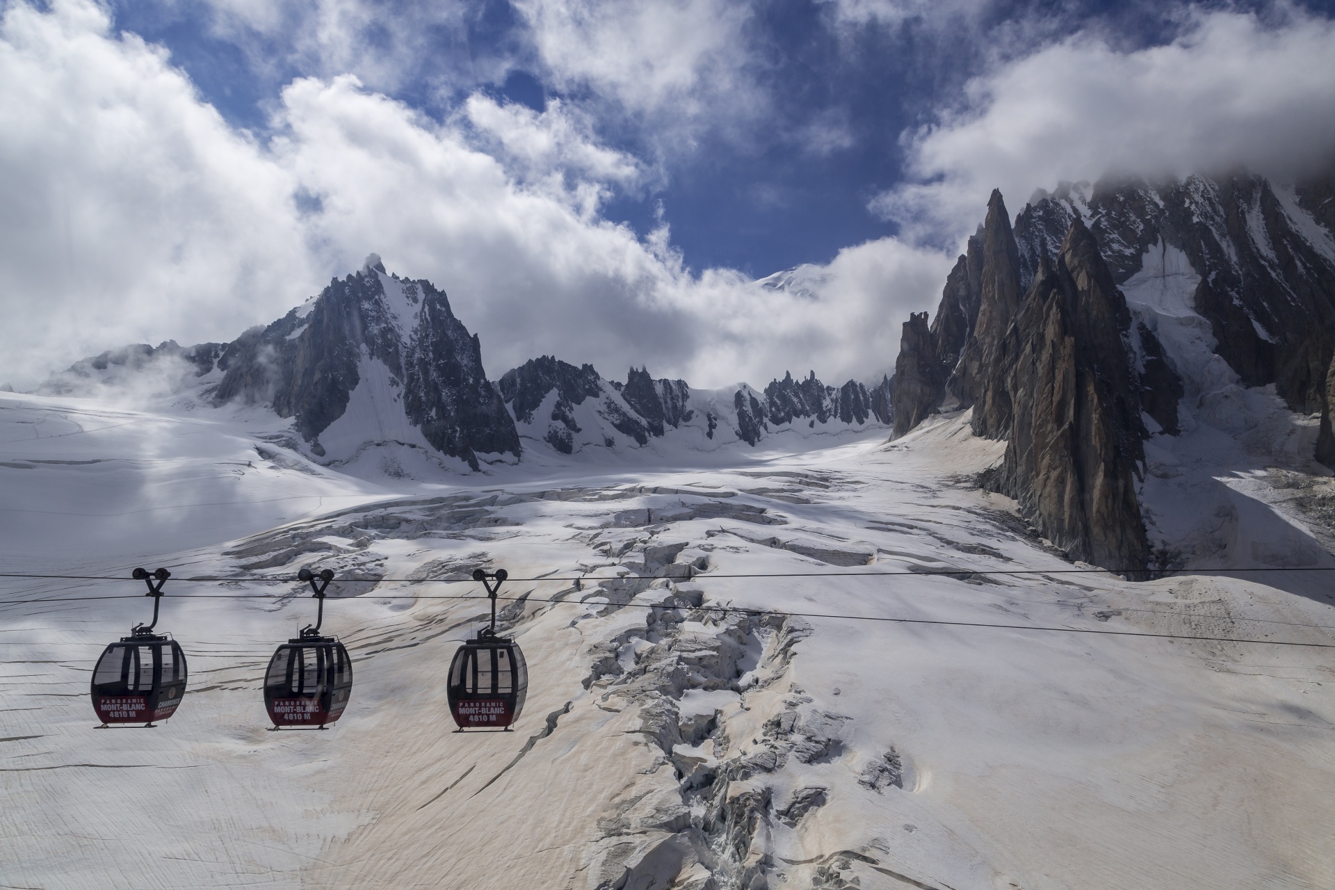 Hellbronner-Aiguille du Midi gondola passing above the Glacier du Geant in the Chamonix ski area