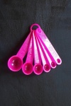 A Set Of Pink Measuring Spoons