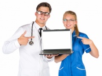 Doctor And Nurse With A Laptop