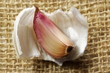 Pink Garlic Clove Lying On Skin
