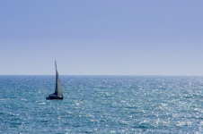 Single Sailing Boat On Wide Sea