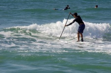 Stand-up Surf Paddle In The Waves