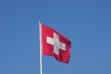 Switzerland Flag Against Blue Sky