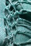 Turquoise Tassles On A Cloth