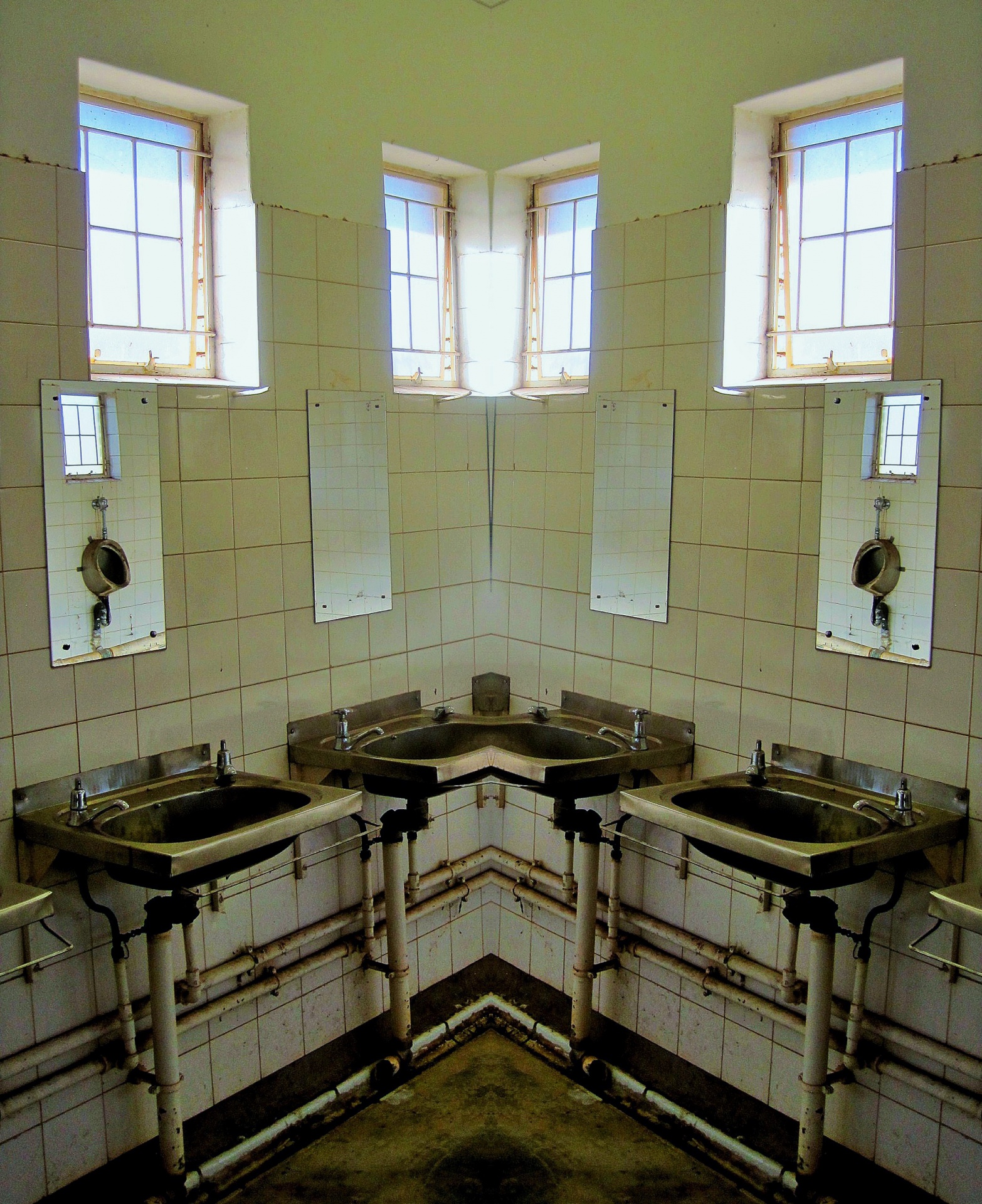 the corner with basins reflected