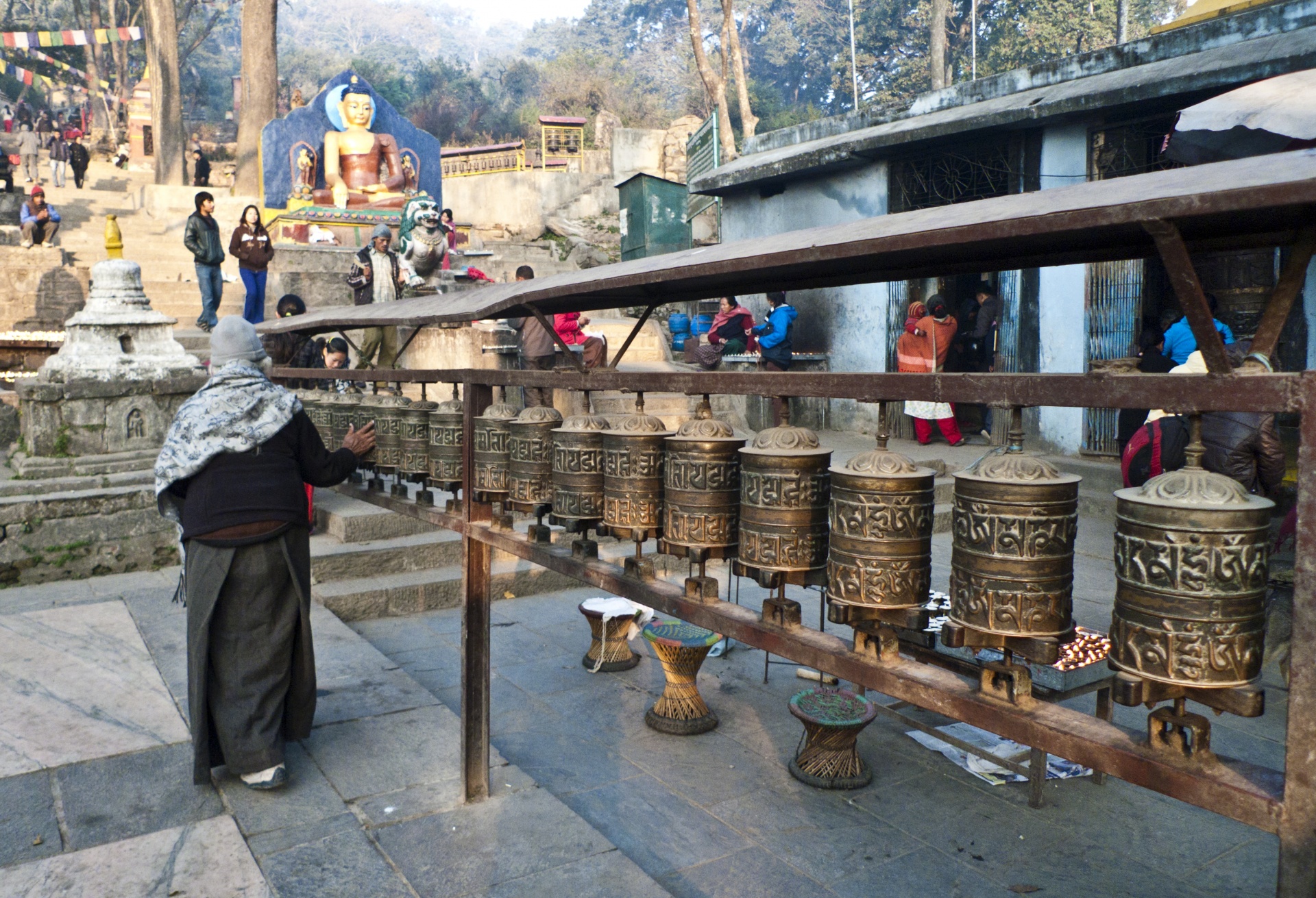 Tibetan prayer wheels, at the foot of the Swayambunath temple hill, Kathmandu, Nepal