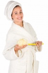 Woman In A Bathrobe And Sponge