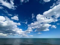 Blue Sea And Clouds In The Sky