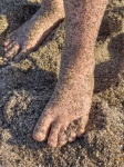 Feet Covered In Sand