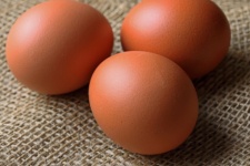 Three Healthy Brown Eggs On Hessian