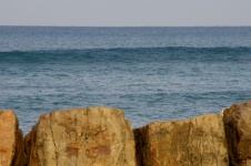 Brown Rocks Against Blue Sea