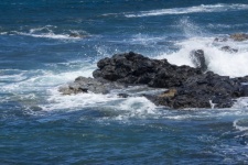 Black Lava Rocks In Ocean