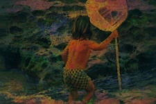 Child With Net At Ocean